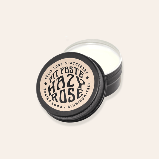 A black tin filled with natural creamy deodorant.