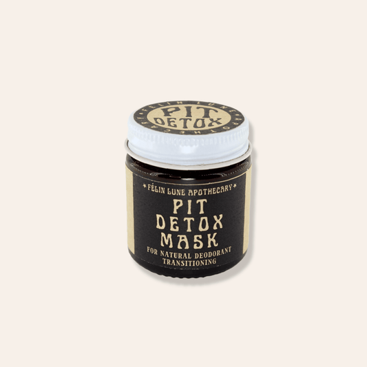 A jar of armpit detox mask on a beige background.