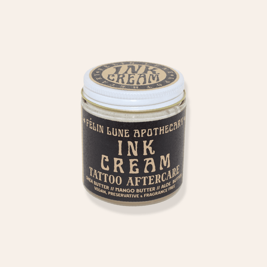 A jar of Ink Cream, a natural tattoo aftercare cream.